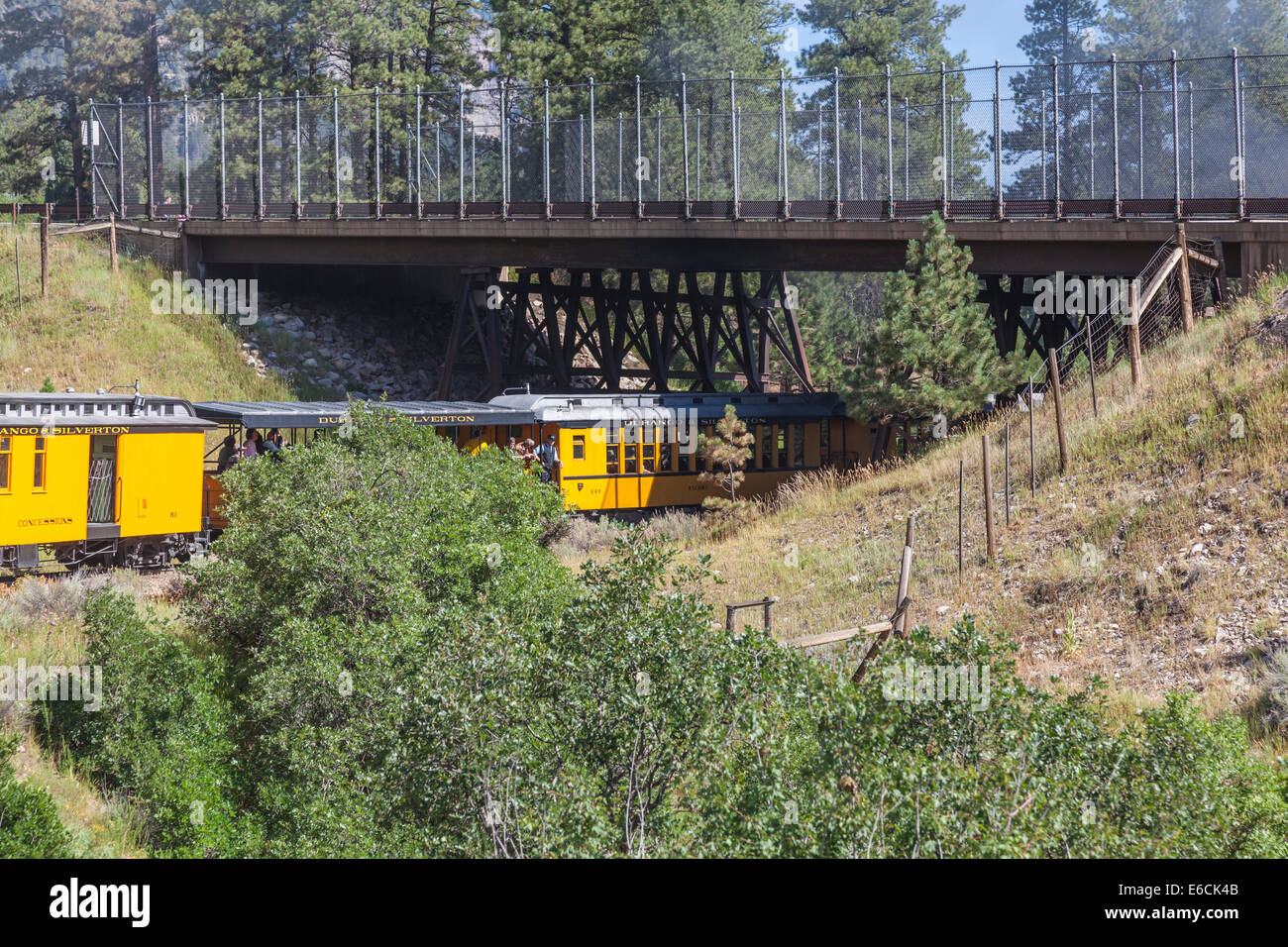 Durango & Silverton NG Railroad train passing under bridge on US 550 near Durango, Colorado. Stock Photo