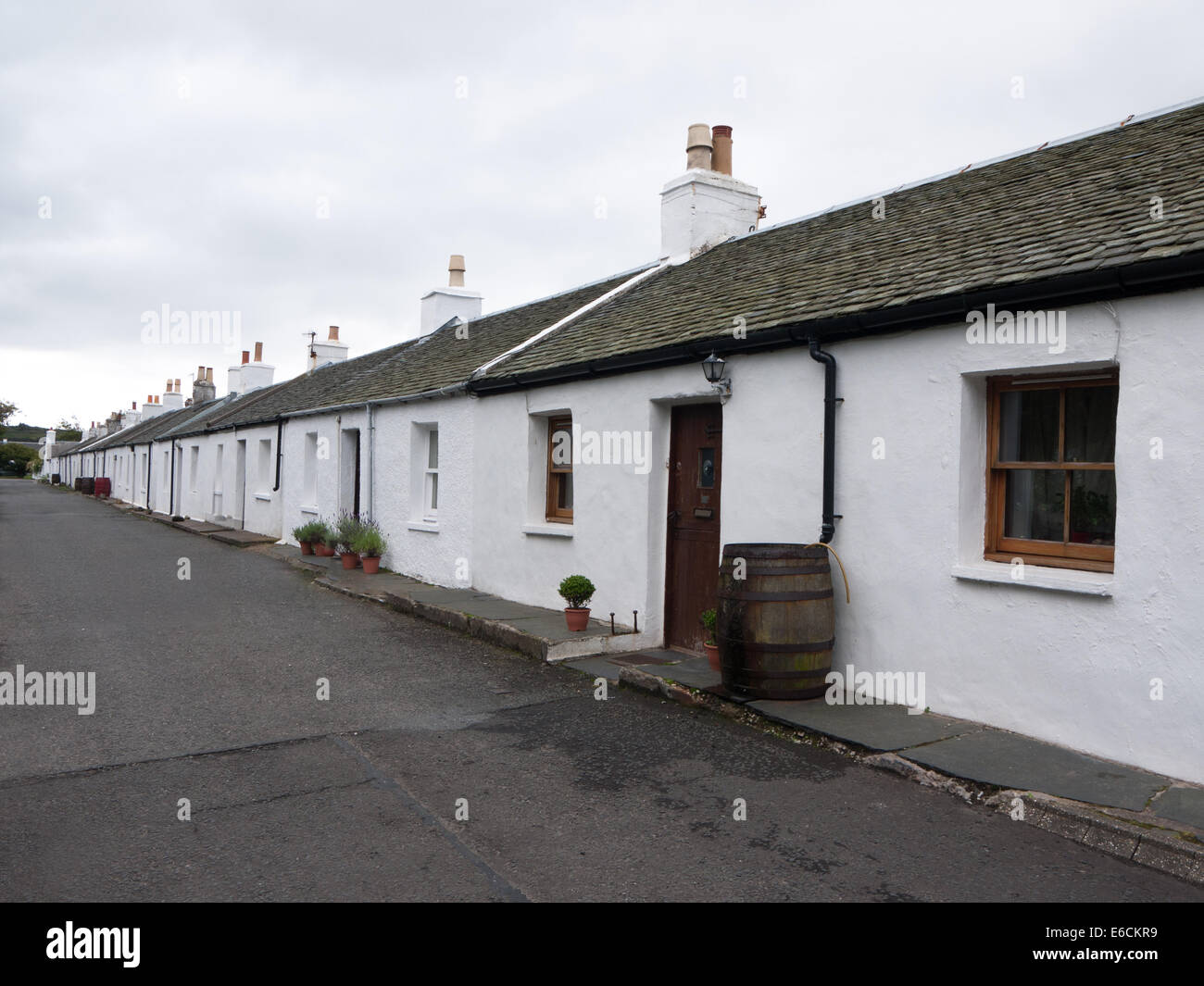 A street of white single storey cottages, Ellenabeich, Easdale, Isle of Seil, Scotland Stock Photo