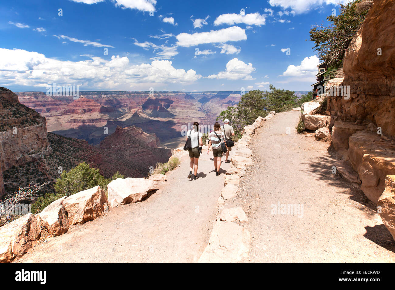 Group of Tourists walking at the Bright Angle Trail at the South Rim of Grand Canyon Stock Photo