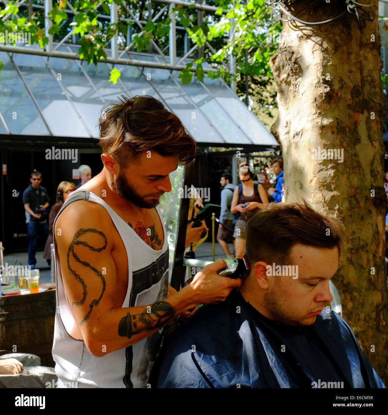 Outdoor Hair Cut On Brick Lane Shoreditch London Stock Photo