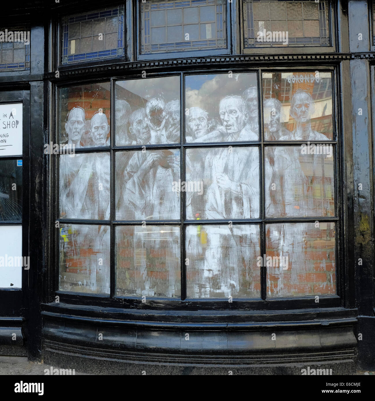 ghost drinkers paint etching in window of empty pub Stock Photo