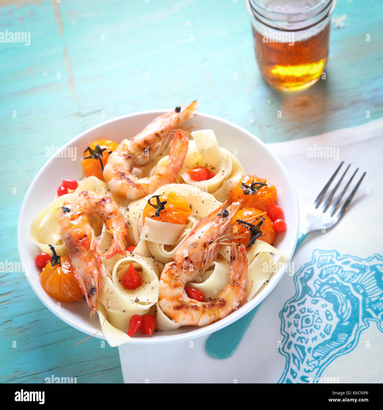 Prawn, tomato, and papardelle pasta with beer Stock Photo