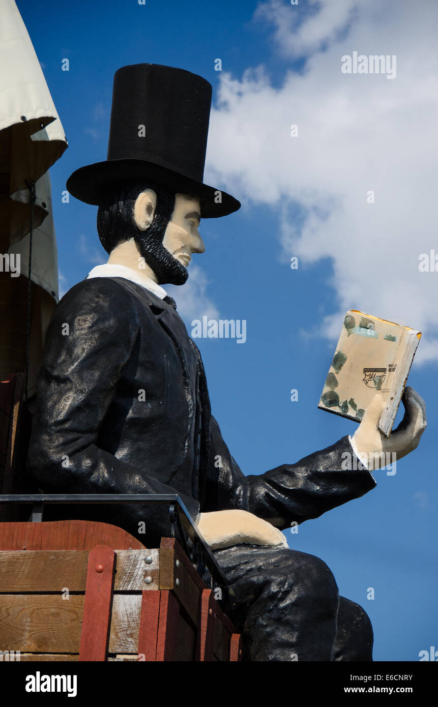 The Railsplitter Covered Wagon features Abraham Lincoln sitting on a ...