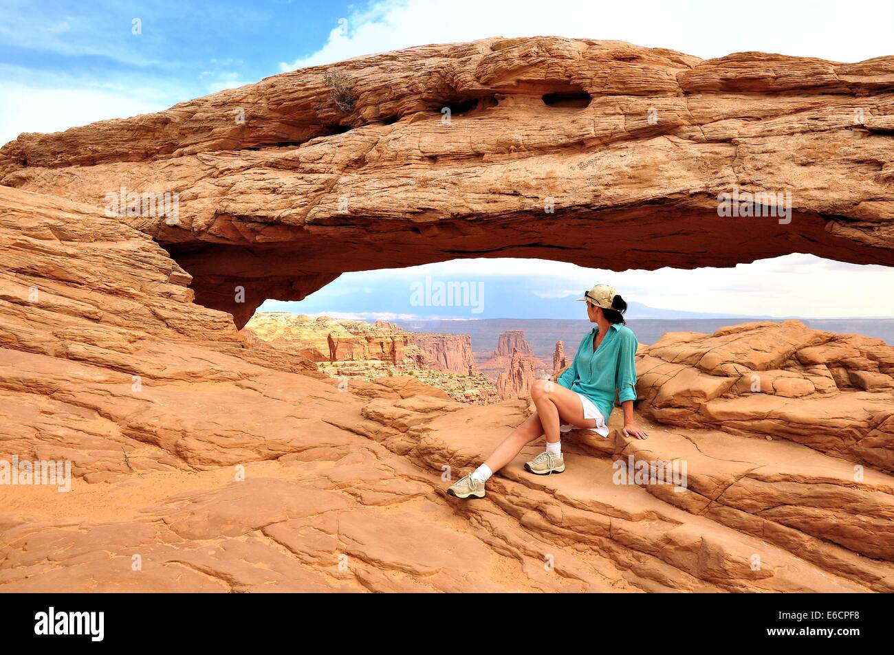 Women in Mesa Arch Canyonlands National Park Stock Photo