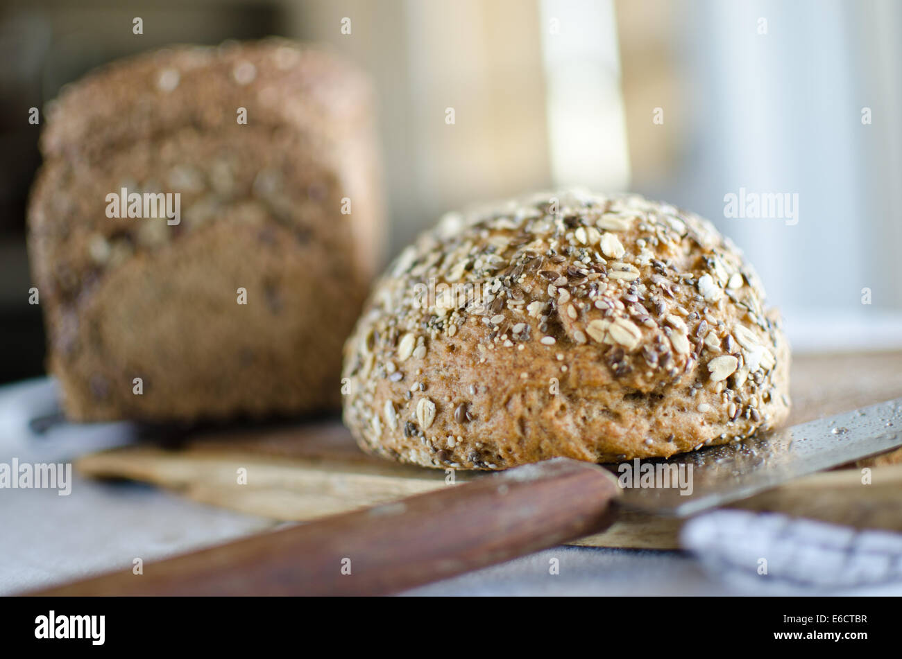 Pieces of homemade wholemeal bread over wooden table Stock Photo - Alamy