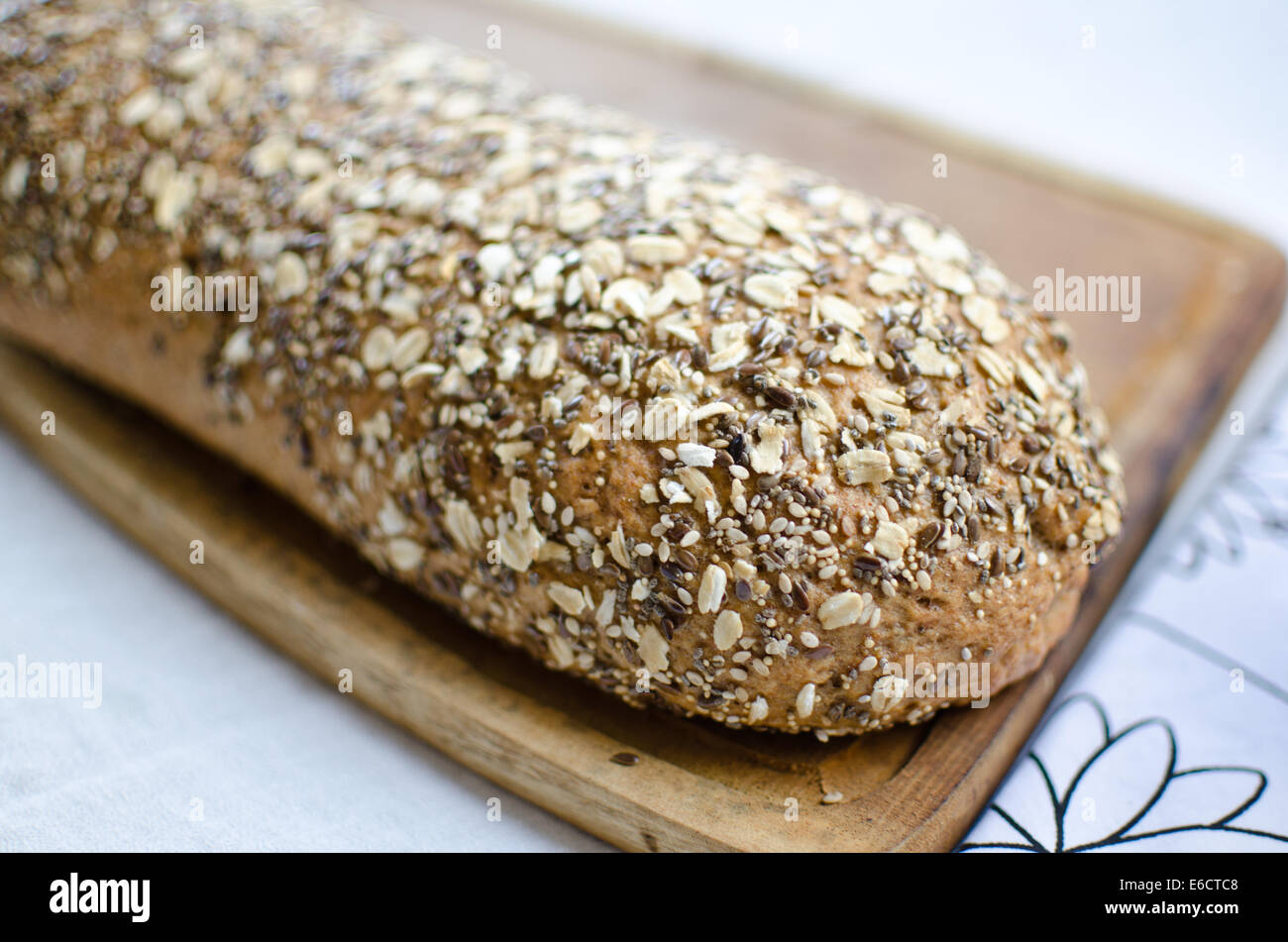 Pieces of homemade wholemeal bread over wooden table Stock Photo - Alamy