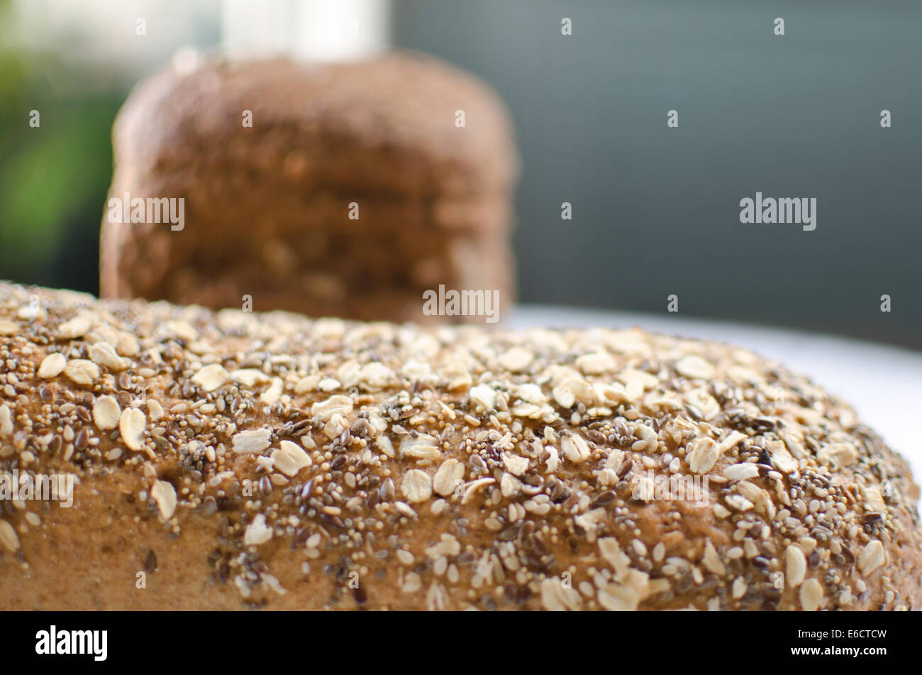 Pieces of homemade wholemeal bread over wooden table Stock Photo - Alamy