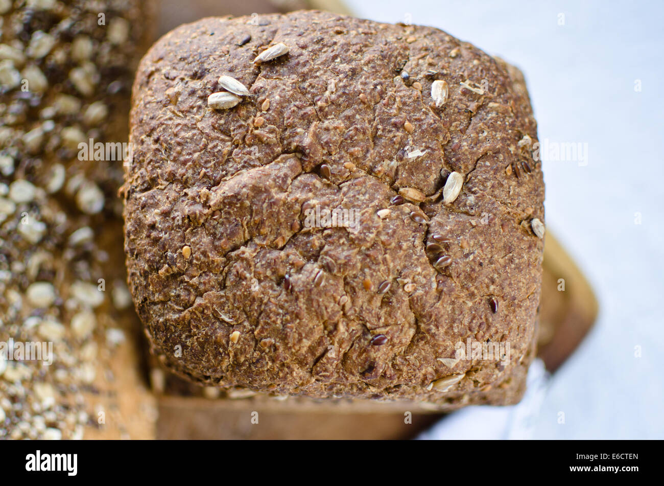 Pieces of homemade wholemeal bread over wooden table Stock Photo - Alamy
