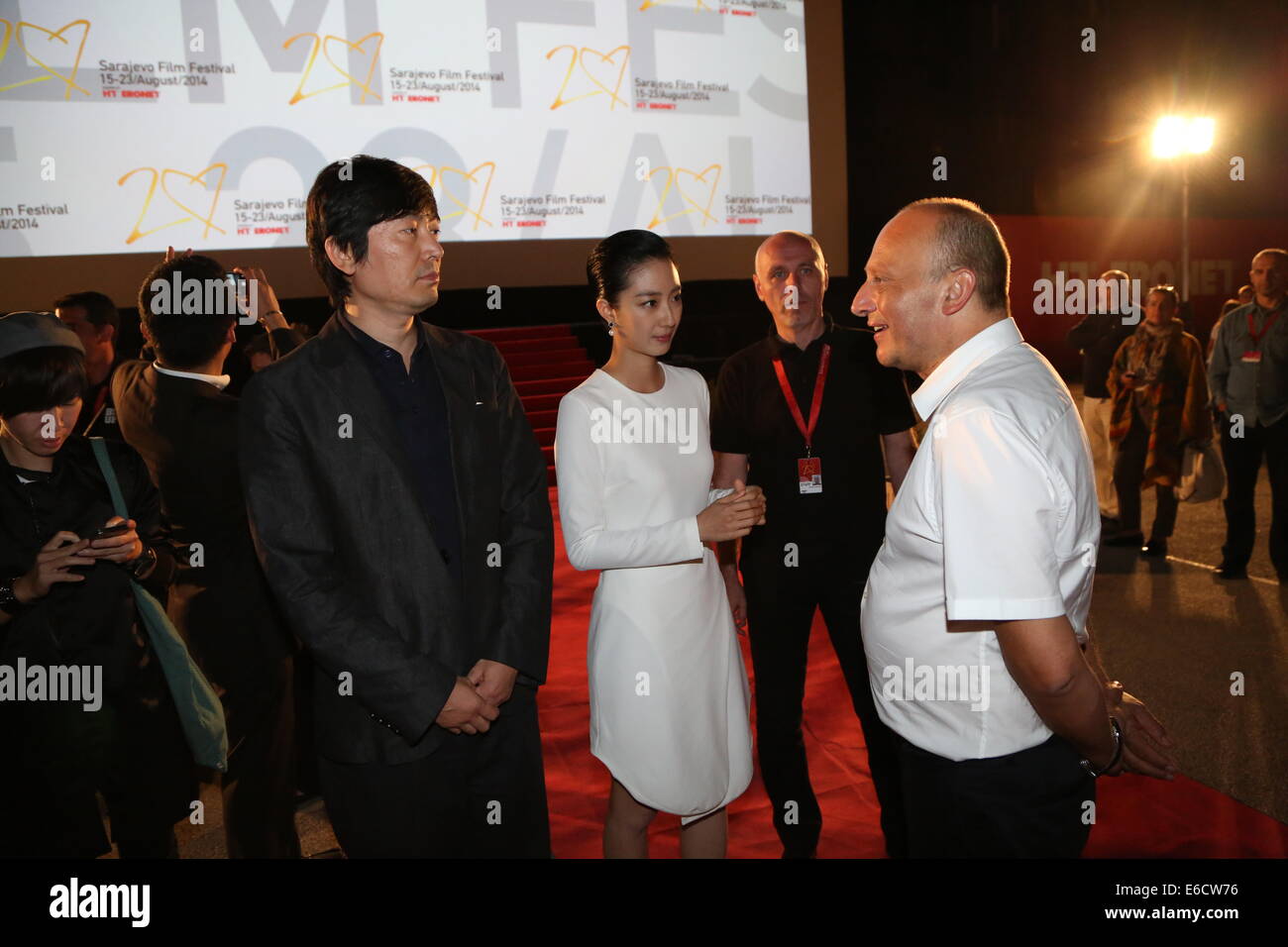 Sarajevo, Bosnia and Herzegovina. 20th Aug, 2014. Chinese director Diao Yinan (L), actress Kwai Lun-mei (C) and Director of Sarajevo Film Festival Mirsad Purivatra attend the open air of the movie 'Black Coal, Thin Ice' in Sarajevo, Bosnia and Herzegovina, on Aug. 20, 2014. 'Black Coal, Thin Ice', a Berlin Gold Bear winner, is in open air program in the ongoing 20th Sarajevo Film Festival. Credit:  Haris Memija/Xinhua/Alamy Live News Stock Photo
