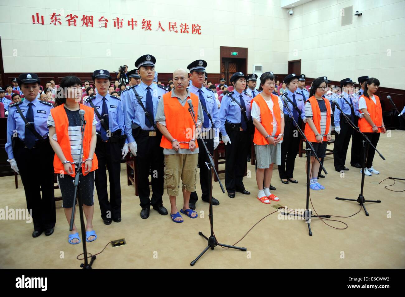 Yantai. 21st Aug, 2014. Five cult members Zhang Fan, Zhang Lidong, Lyu Yingchun, Zhang Hang and Zhang Qiaolian stand trial on murder charges in Yantai Intermediate People's Court in Yantai City, east China's Shandong Province, Aug. 21, 2014. A woman surnamed Wu was beaten to death on May 28 at a McDonald's outlet in Zhaoyuan City, Yantai, after she refused to give her telephone number to the suspects, who were allegedly trying to recruit new members for their cult Quannengshen, which means 'almighty god.' Credit:  Xinhua/Alamy Live News Stock Photo
