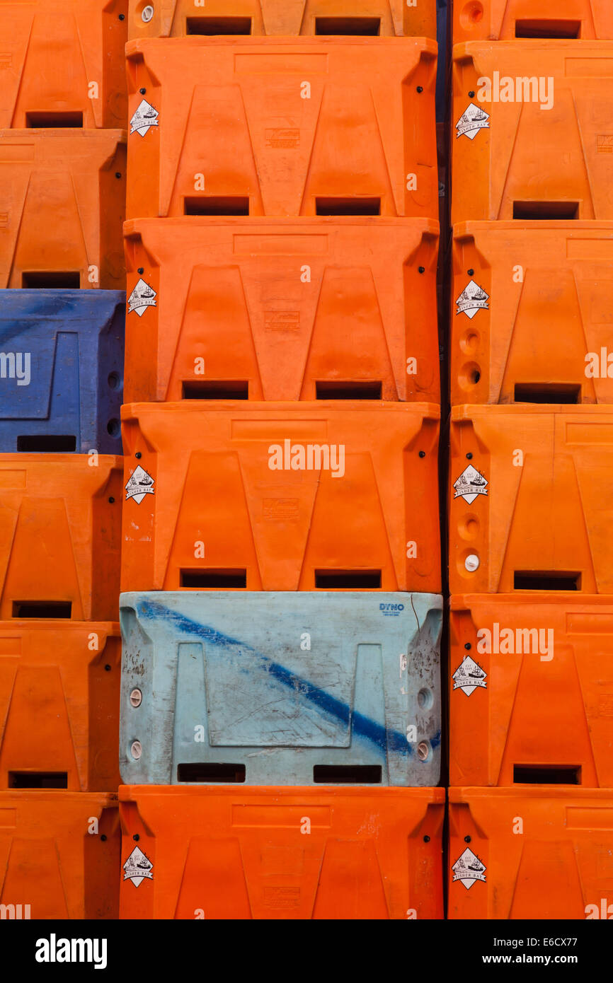 Abstract image of orange fish containers at a fish packing factory in Vancouver, Canada Stock Photo
