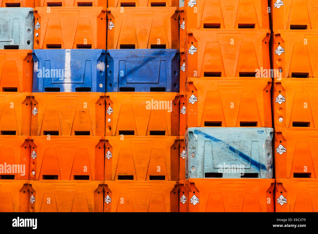 Abstract image of orange fish containers at a fish packing factory in Vancouver, Canada Stock Photo