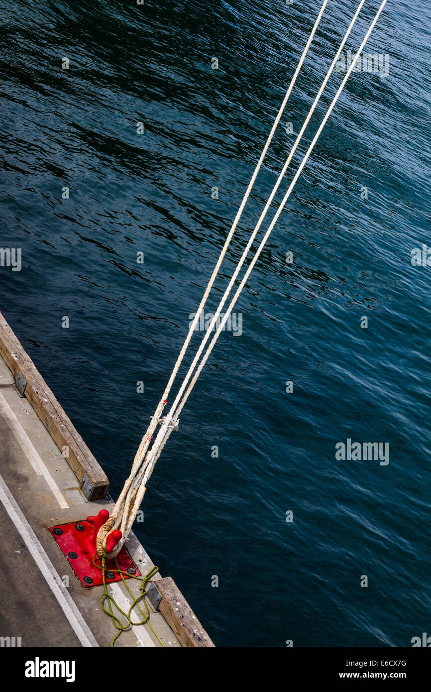 Mooring lines securing a large ship to a dock, Vancouver, British Columbia, Canada Stock Photo