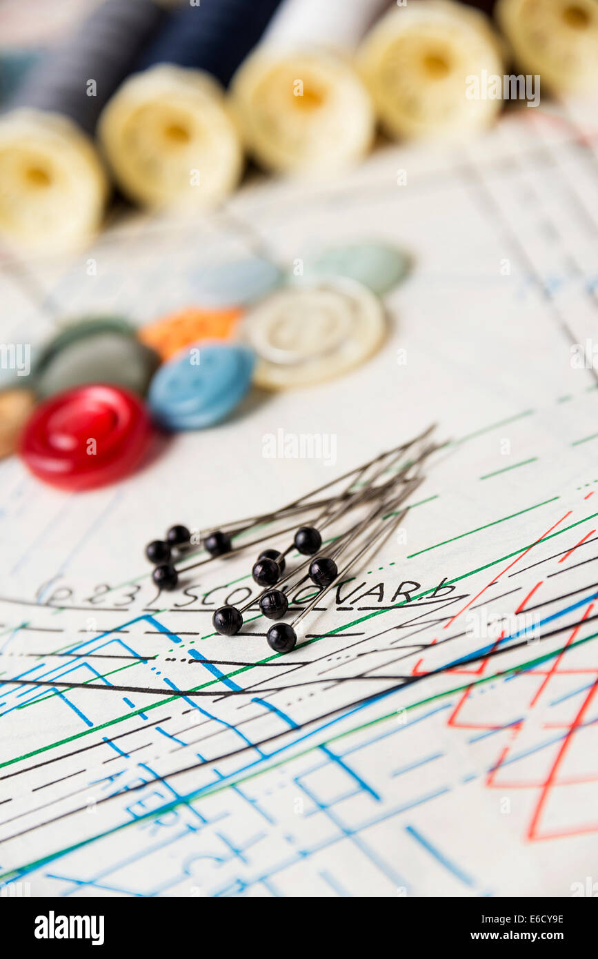 Accessory of the tailor: pins,  thread,  buttons and pattern Stock Photo