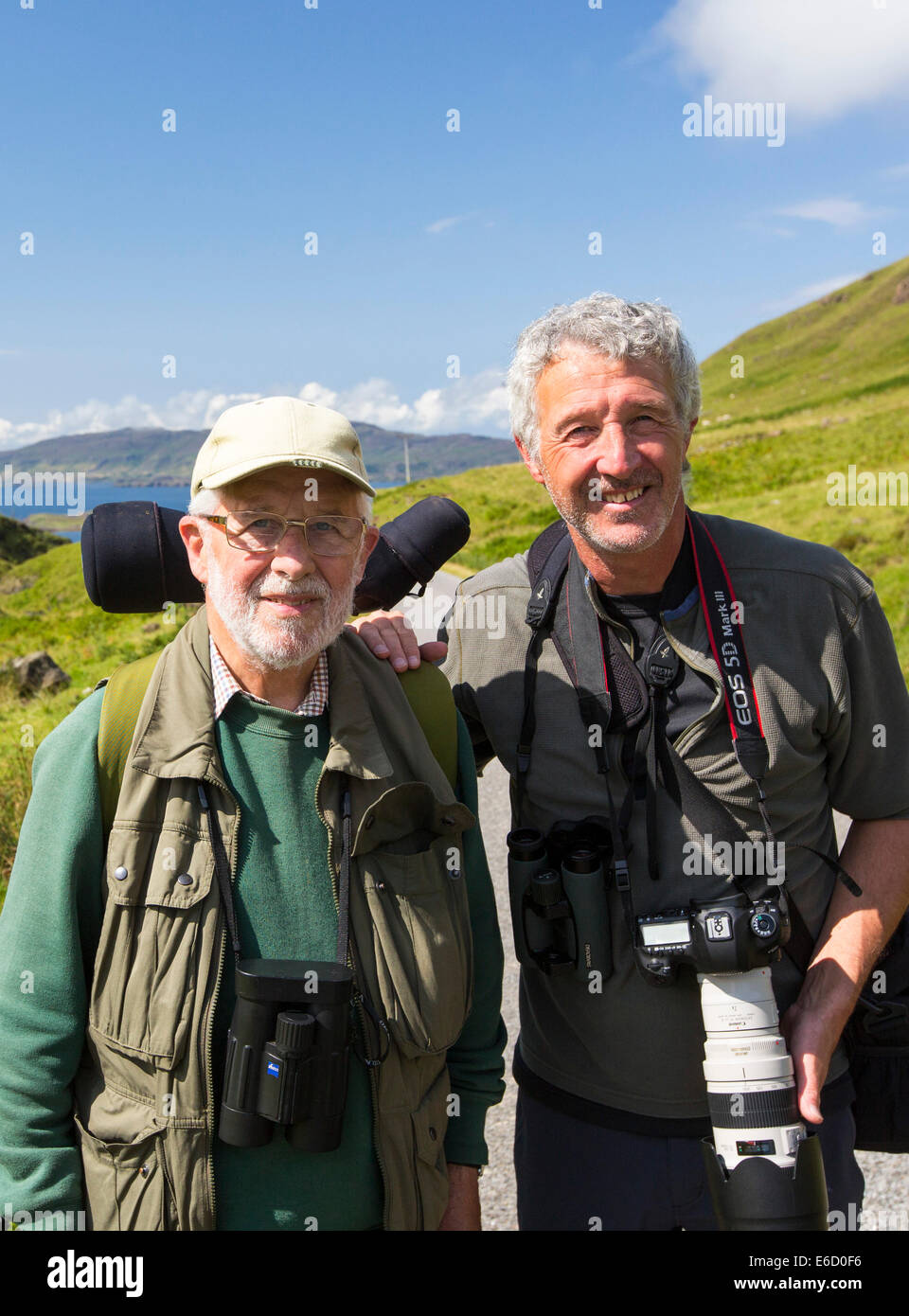 A father and son on an Isle of Mull Wildlife tour showing the islands wildlife to tourists, Isle of Mull, Scotland, UK. Stock Photo