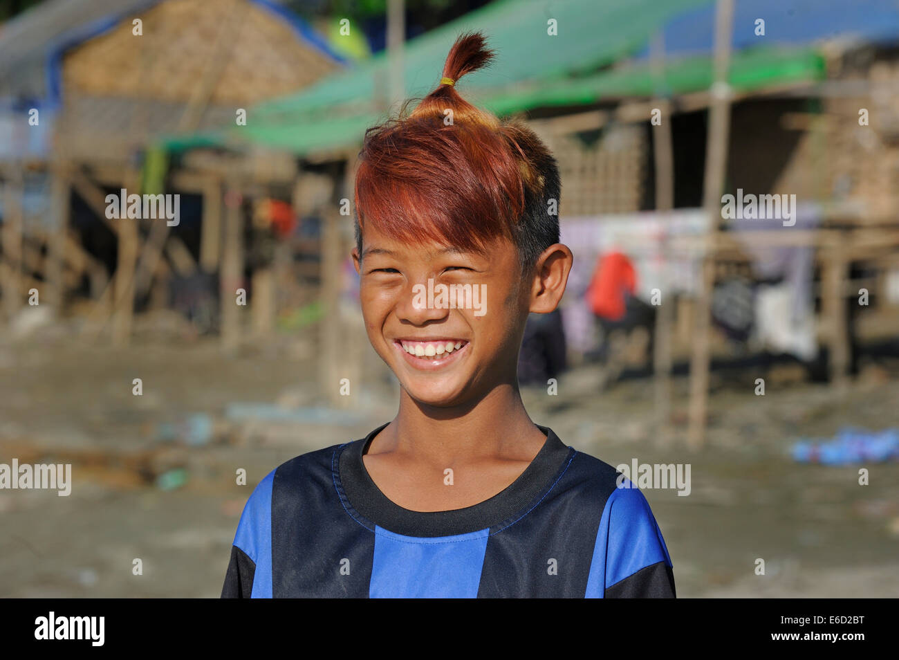 Boy from the slums with dyed hair and fashionable hairstyle, Irrawaddy, Mandalay, Mandalay District, Myanmar Stock Photo
