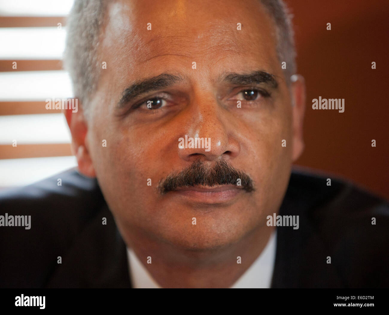Ferguson, Mo. 20th Aug, 2014. United States Attorney General Eric Holder during his meeting with local community leaders at Drake's Place Restaurant, Wednesday, Aug. 20, 2014 in Ferguson, Mo. Holder traveled to the St. Louis-Area to oversee the federal government's investigation into the shooting of 18-year-old Michael Brown by a police officer on Aug. 9th. Holder promised a 'fair and thorough' investigation into the fatal shooting of a young black man, Michael Brown, who was unarmed when a white police officer shot him multiple times. Credit:  dpa picture alliance/Alamy Live News Stock Photo
