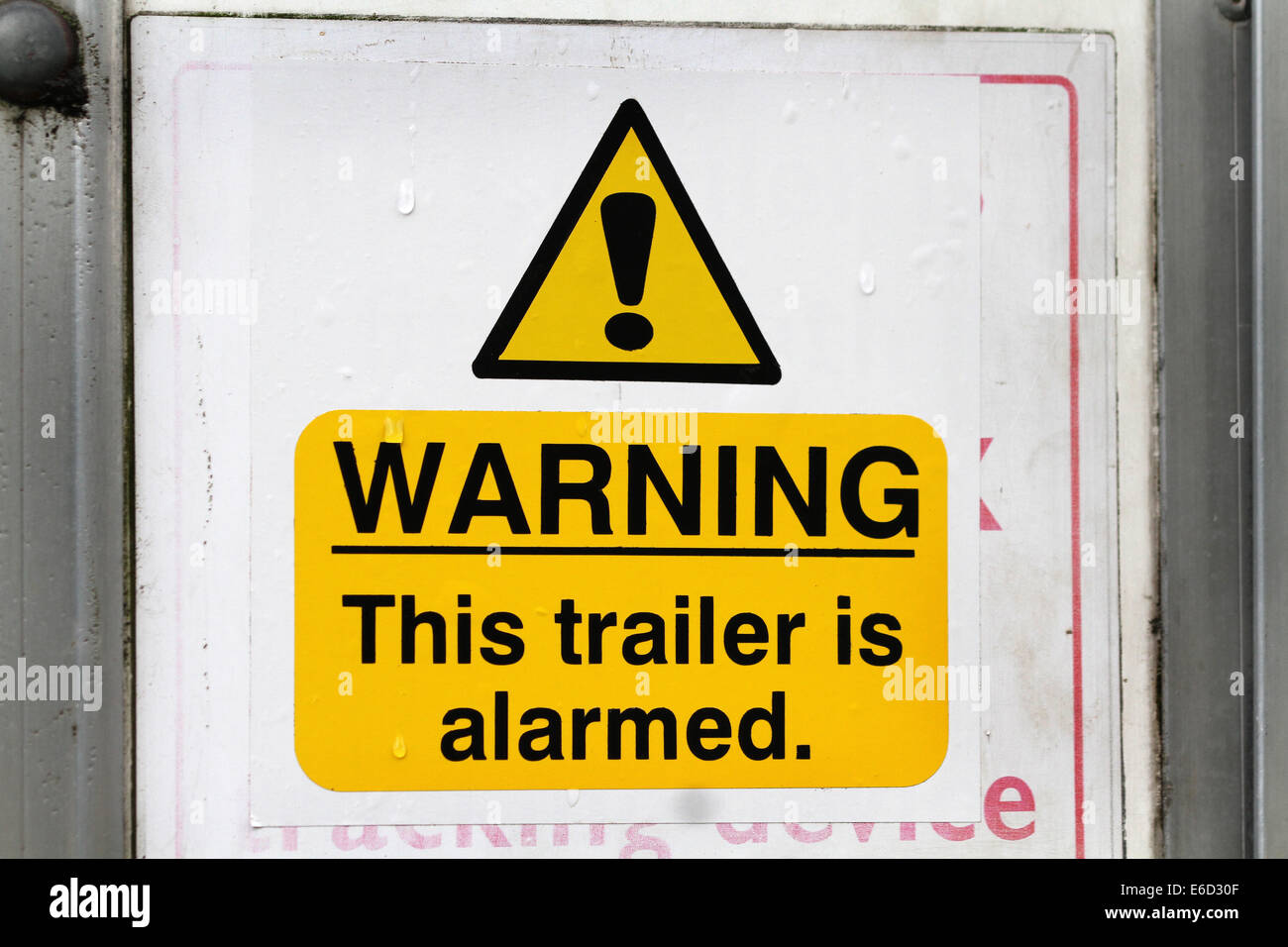 Warning sign on trailer to deter thieves. Stock Photo