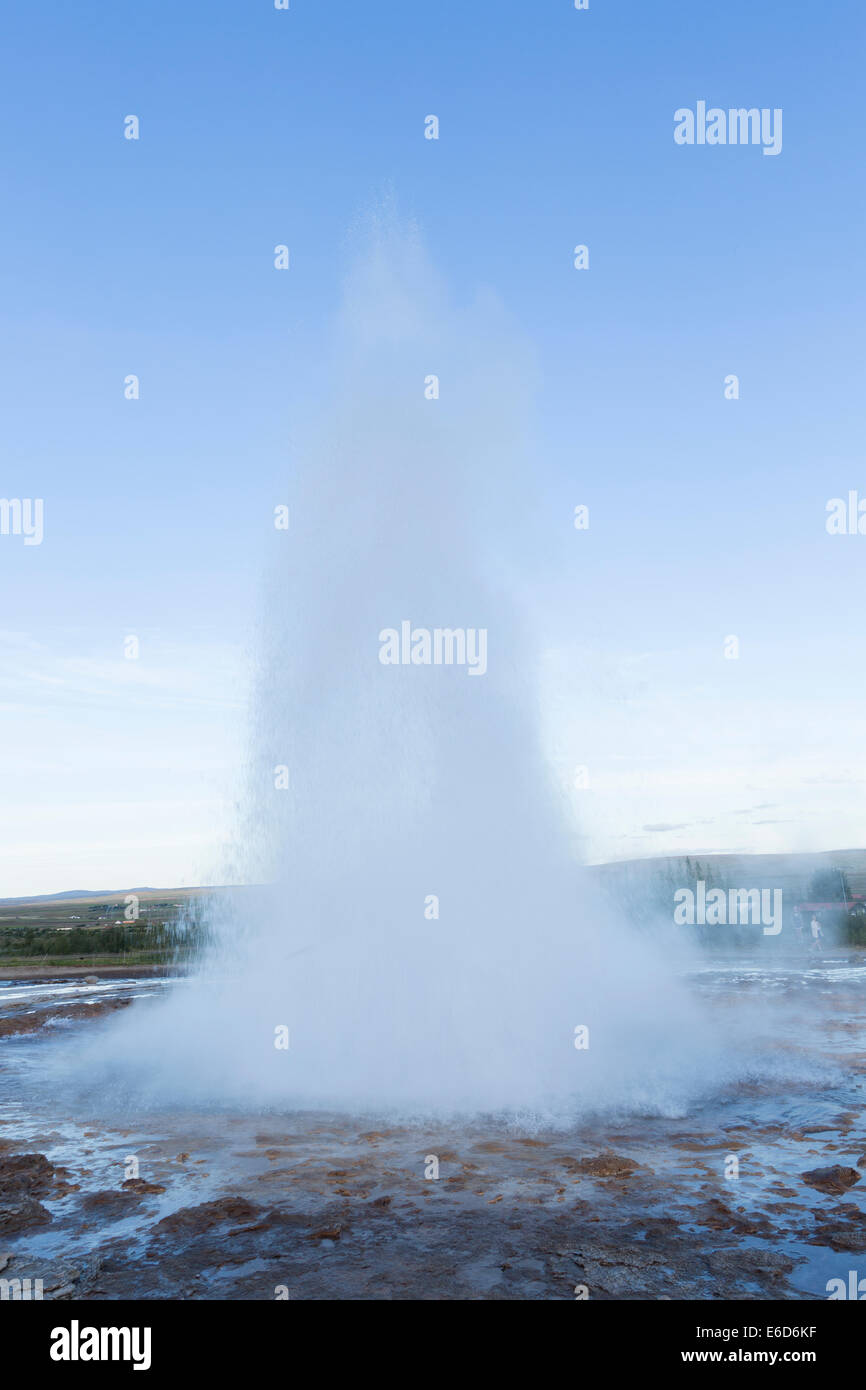 Strokkur geyser erupting during a fine summer's evening in southern Iceland. Stock Photo