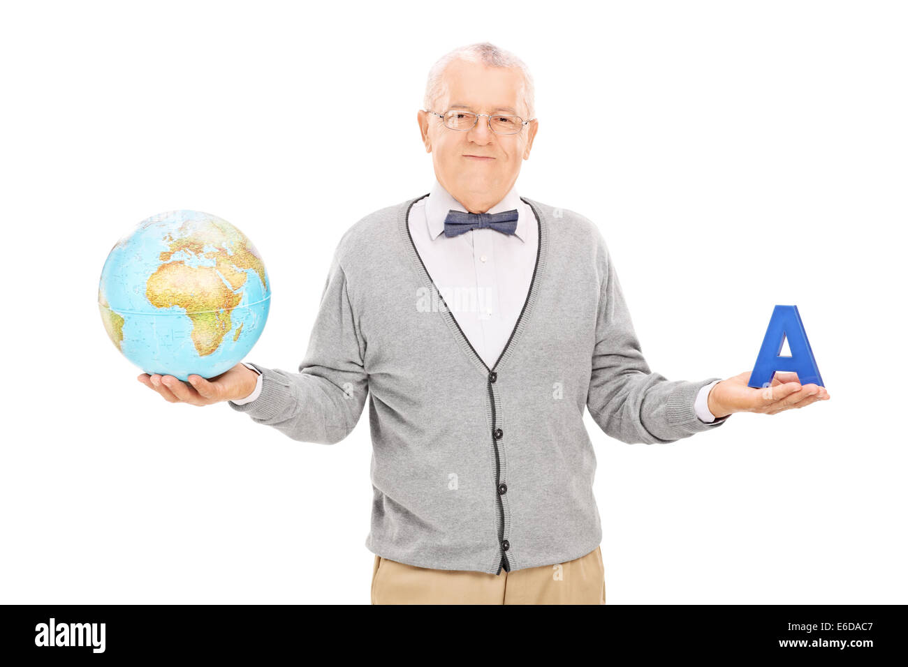 Mature geography teacher holding a globe and a letter Stock Photo Alamy