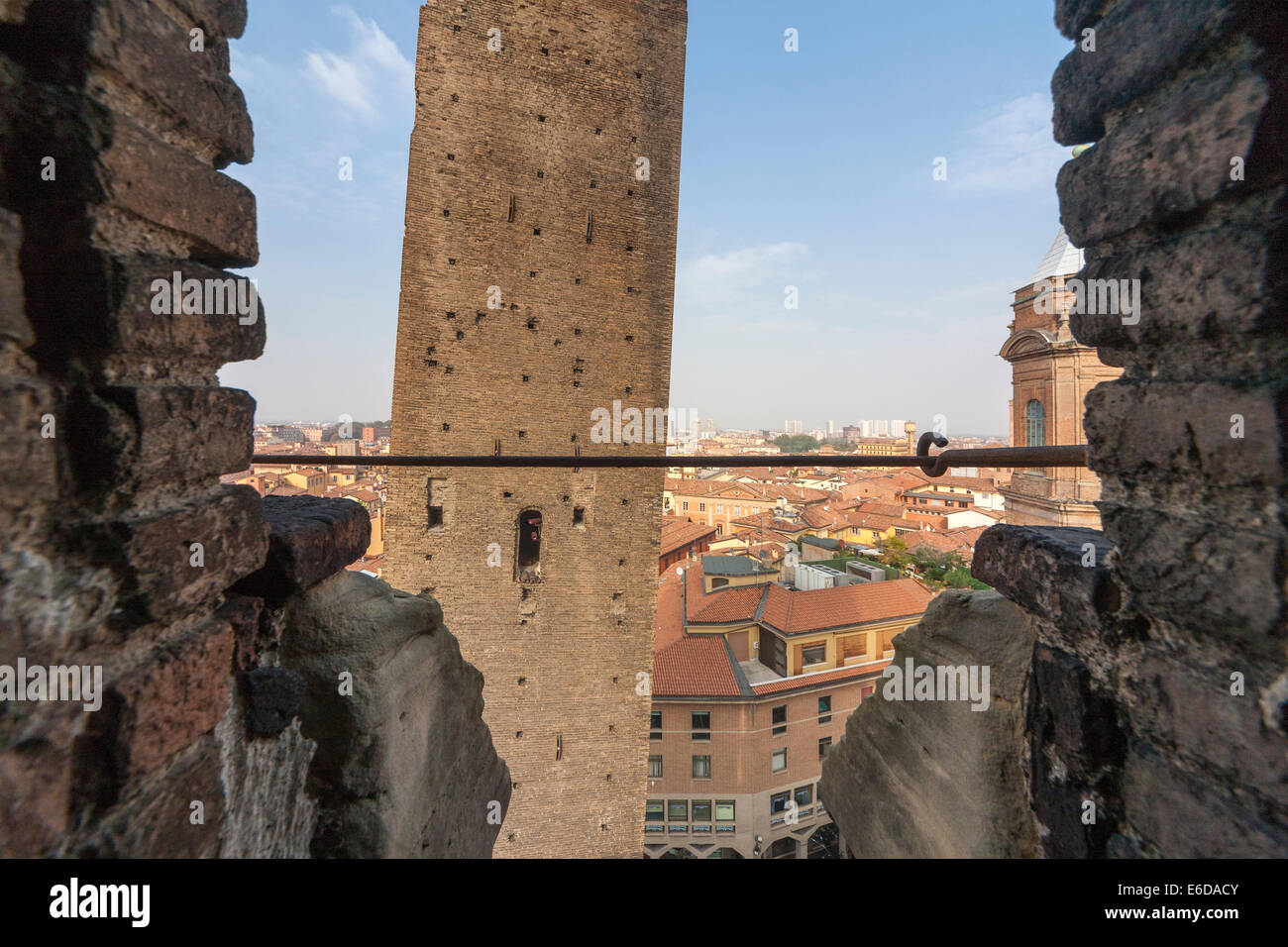 Bologna Leaning, tilting Garisenda Tower seen from the Asinelli Tower. Stock Photo