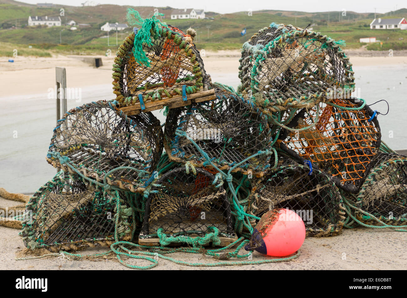 Lobster pots stacked up on the quay on Clare Island, Westport, County