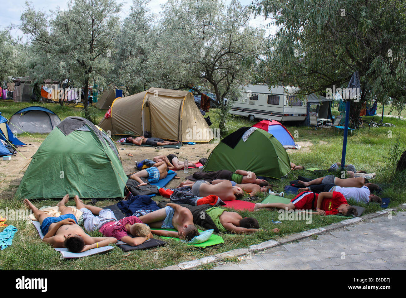 Mamaia, Romania - July 24,2014: Boys in a camping sleeping in the middle of the day, probably drugged Stock Photo