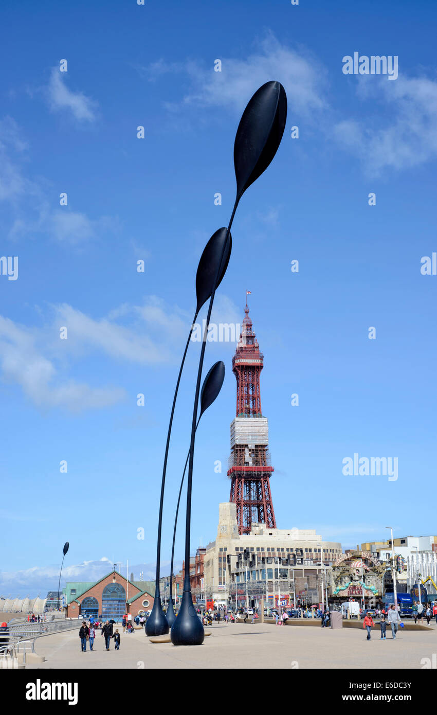 Blackpool Tower in Lancashire, England viewed from the promenade showing seed pod art installation Stock Photo