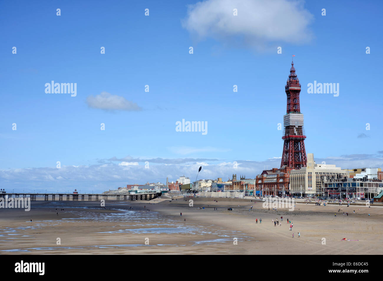 Blackpool Tower in Lancashire, England viewed across the sandy beach from Central Pier Stock Photo
