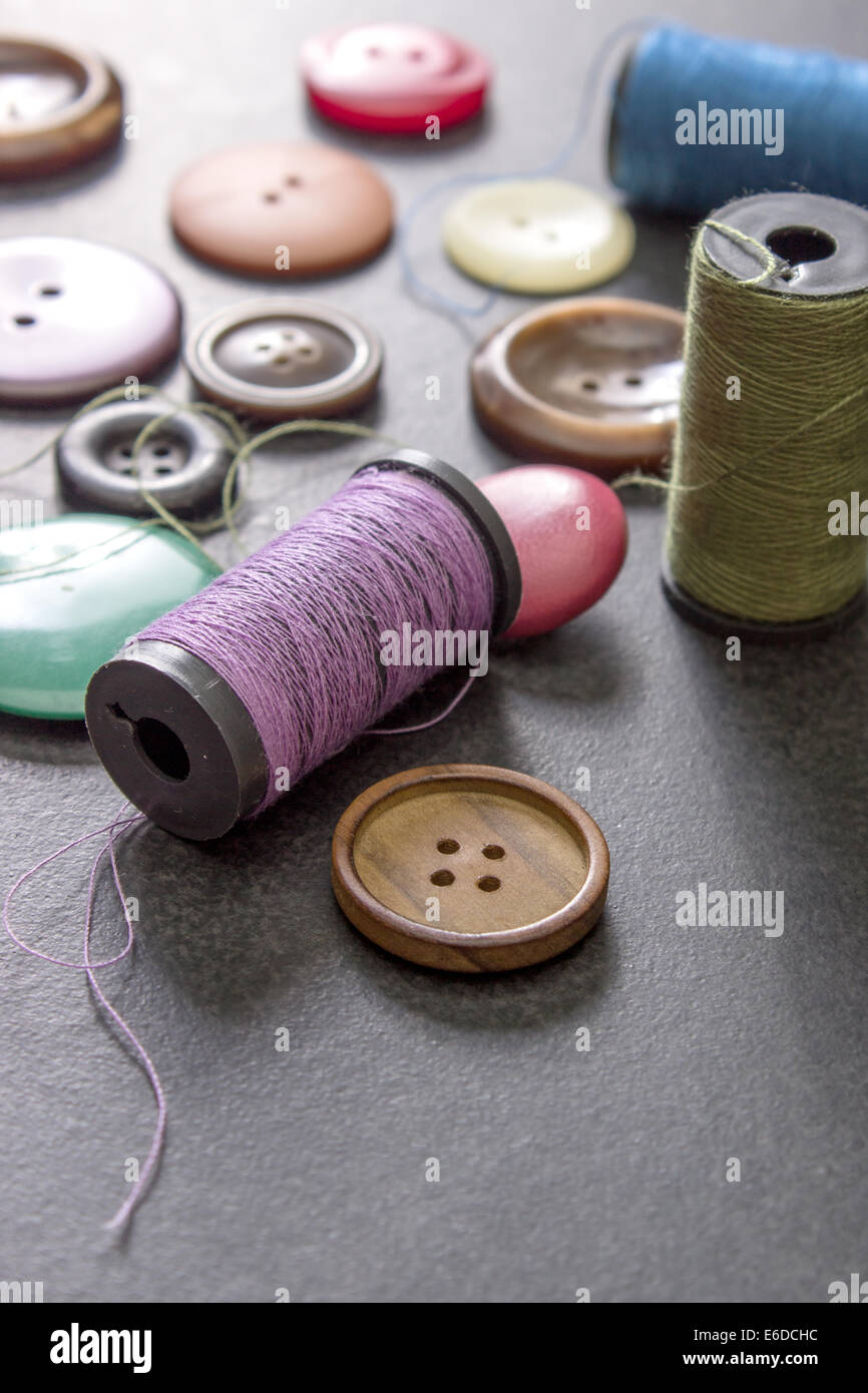 sewing thread and buttons on table, close up Stock Photo