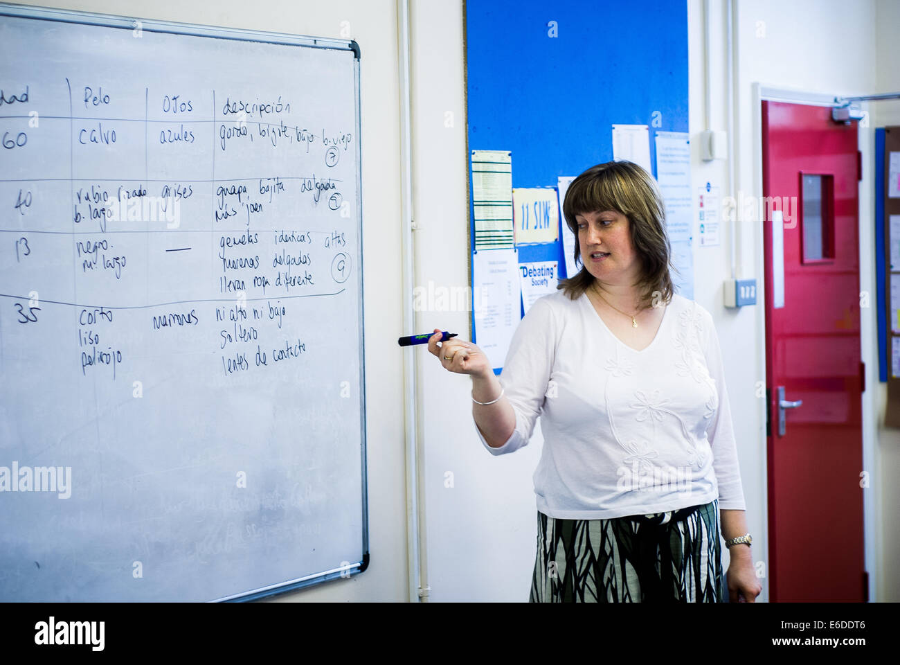 Female modern languages teacher teaching Spanish to a comprehensive school class in Cirencester,UK Stock Photo