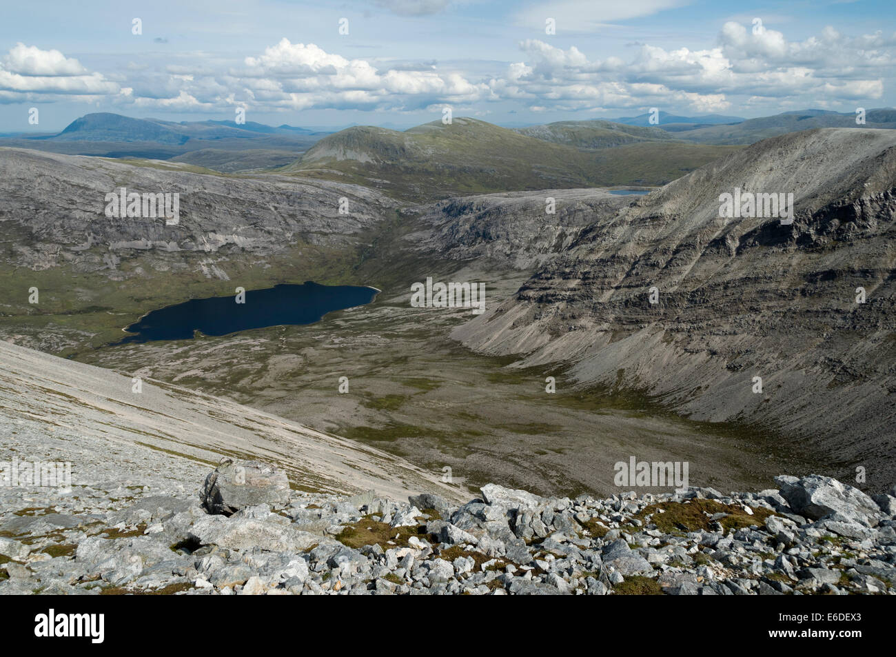 Ben Hope over Loch an Easain Uaine from the summit ridge of Arkle, Sutherland, Scotland, UK. Stock Photo