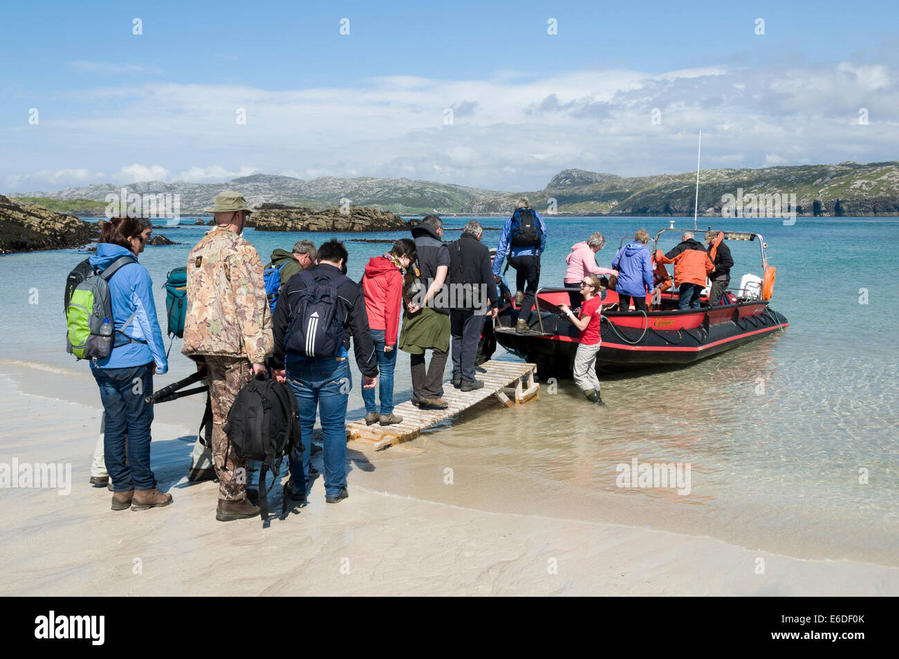 The passengers boarding the ferry on the beach on the east coast of Handa Island, Sutherland, Scotland, UK Stock Photo