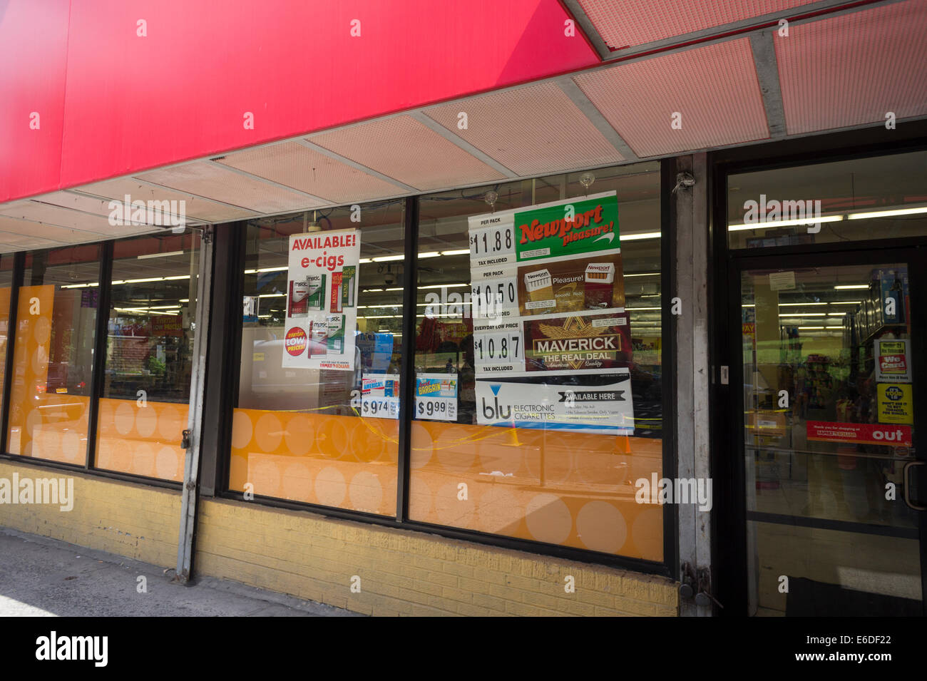 Cigarettes and e-cigs advertised in the window of a Family Dollar store in  the Bronx borough of New York Stock Photo - Alamy