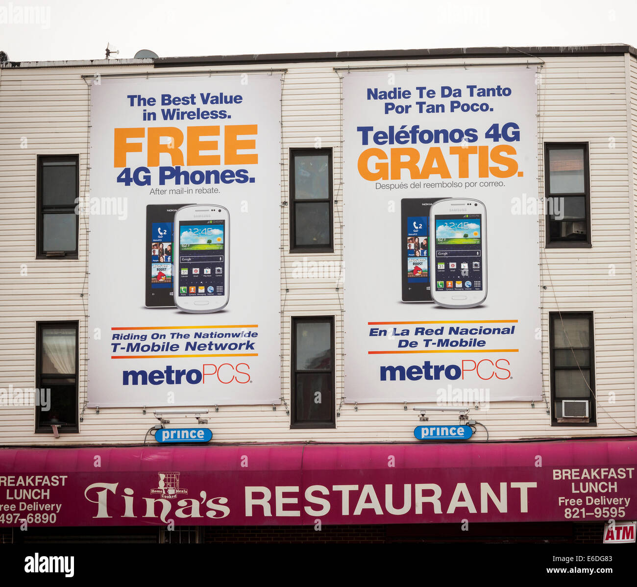 Bilingual billboards for MetroPCS cellular service in the Bushwick neighborhood of Brooklyn in New York Stock Photo