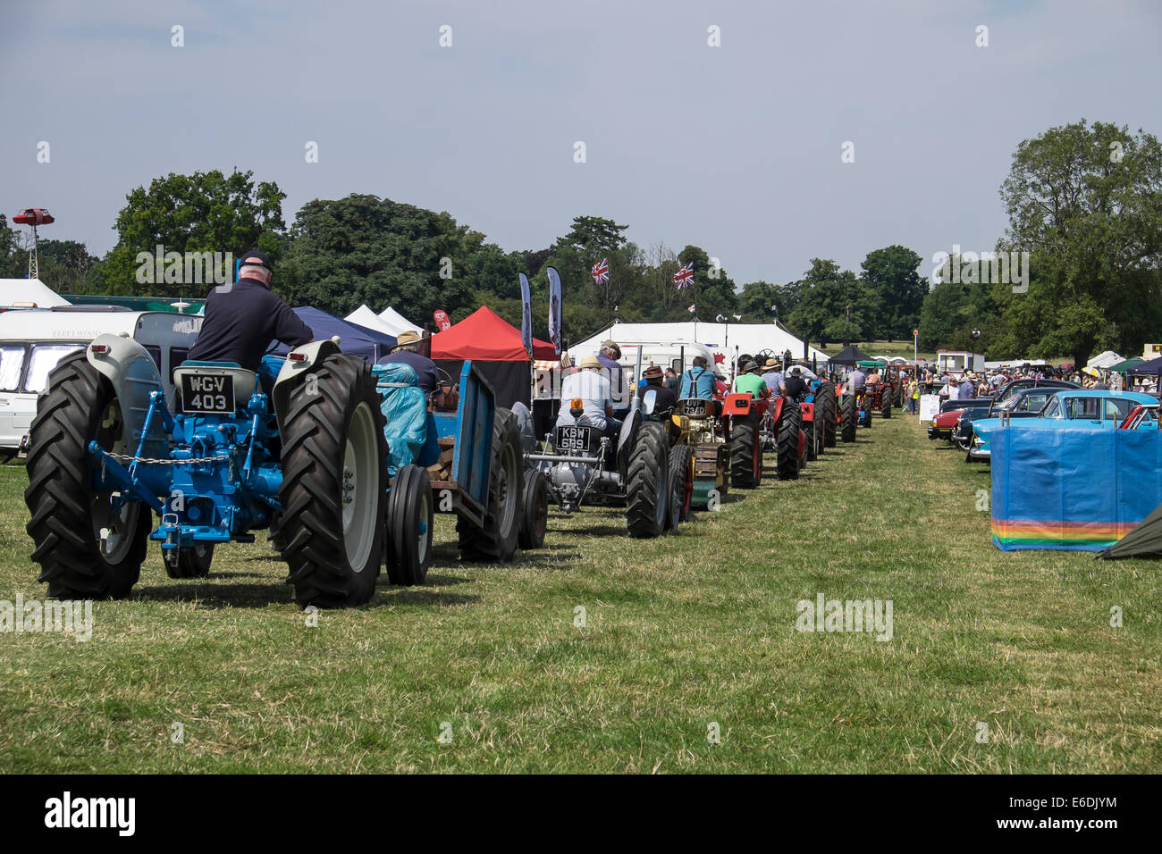 tractors queuing to enter arena at show ground for Cambridgeshire Steam Rally and Country Fair England Stock Photo