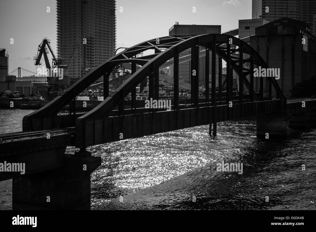 Disused railway bridge over canal in Toyosu, Koto-ku, Tokyo, Japan Stock Photo