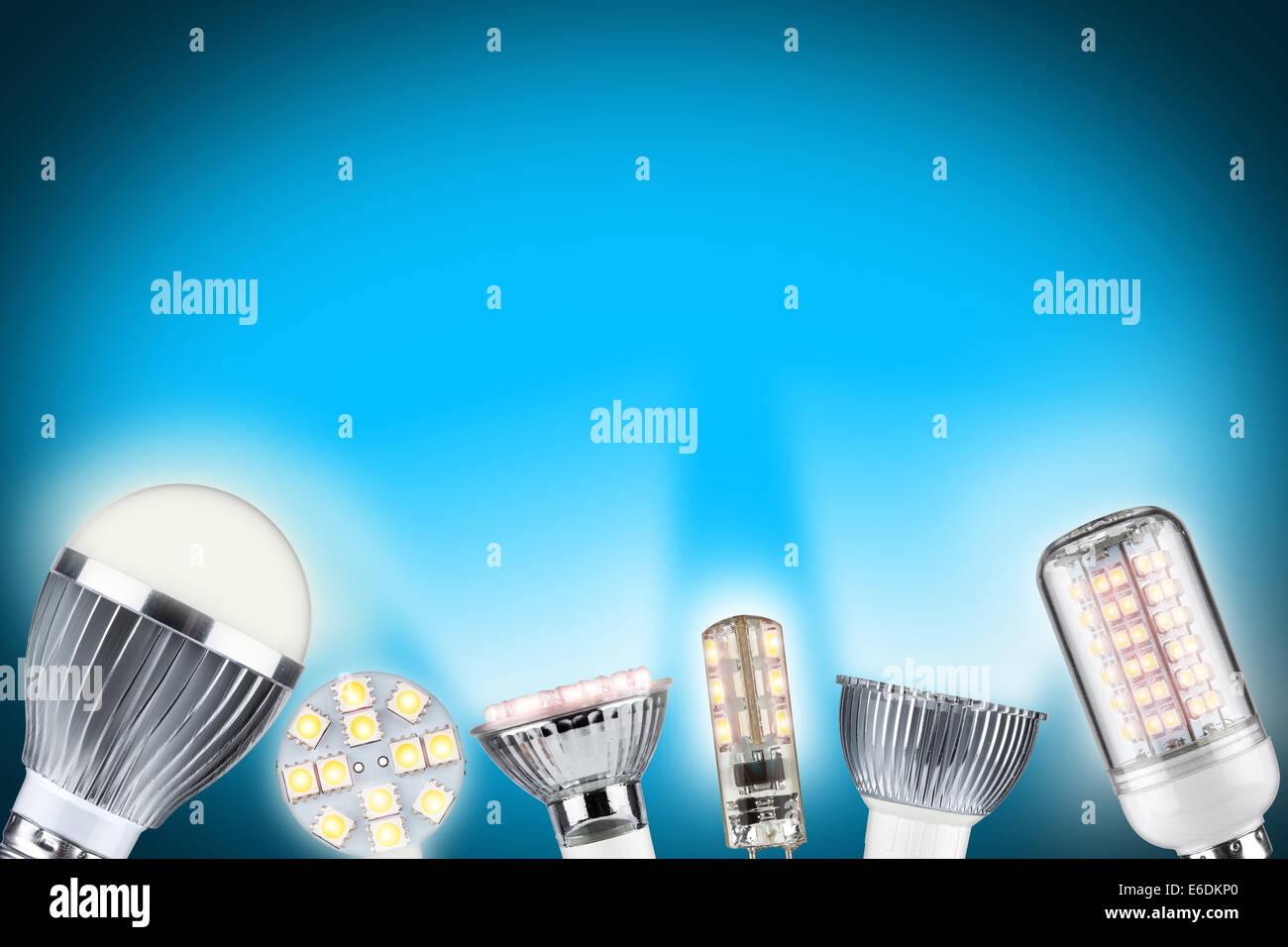 row of different types of glowing light bulbs Stock Photo