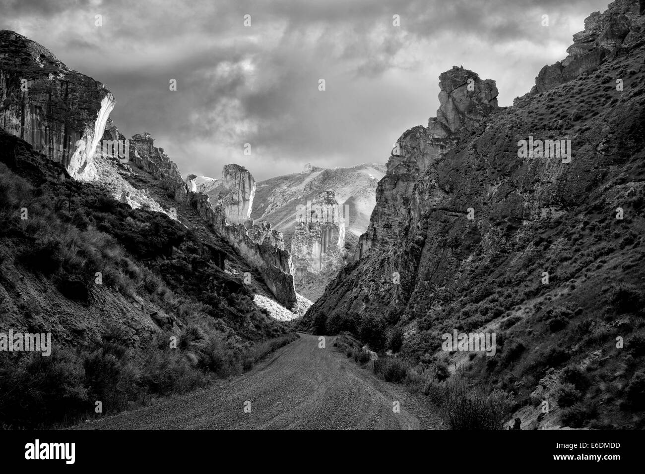 Road and rock formations in Leslie Gultch, Malhuer County, Oregon Stock Photo