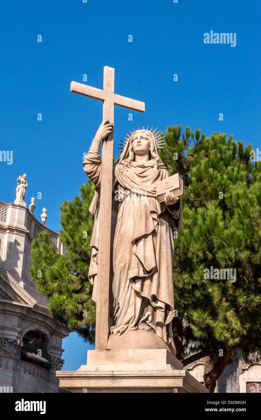 Statue of Saint Agatha of Sicily holding a cross Stock Photo Alamy
