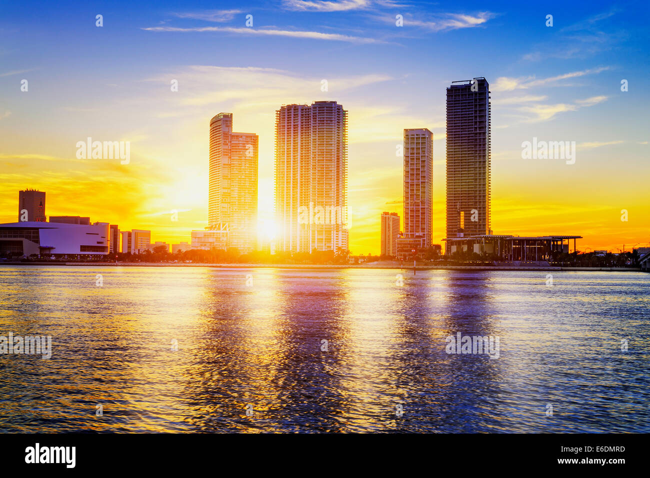 Miami city skyline panorama at dusk with urban skyscrapers over sea with reflection Stock Photo