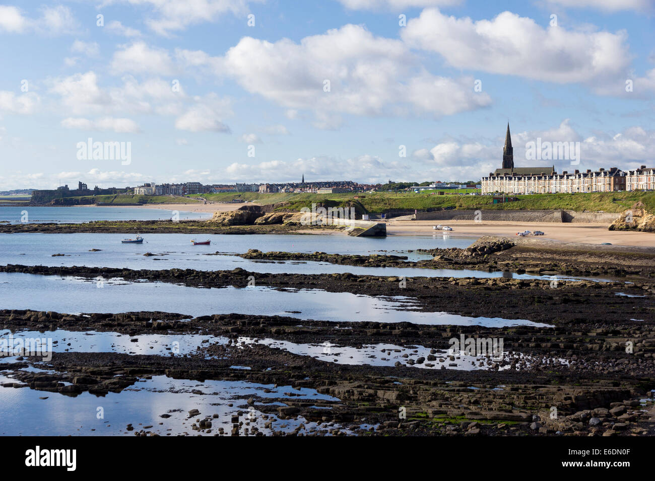 The sandy beaches and rocky shoreline at Cullercoats Bay, Tynemouth, near Newcastle Stock Photo