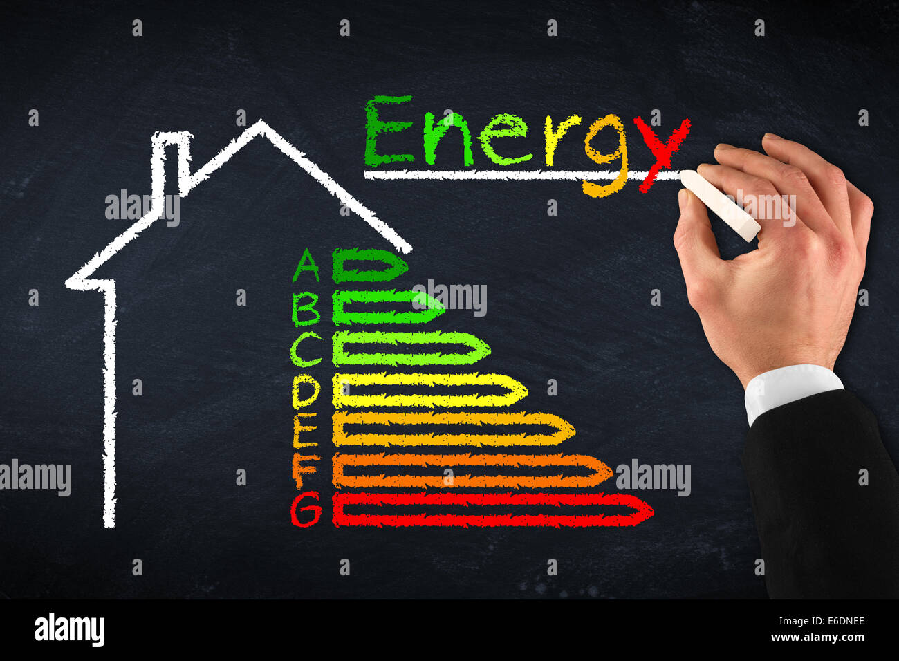 chalkboard with hand and energy efficiency drawing Stock Photo