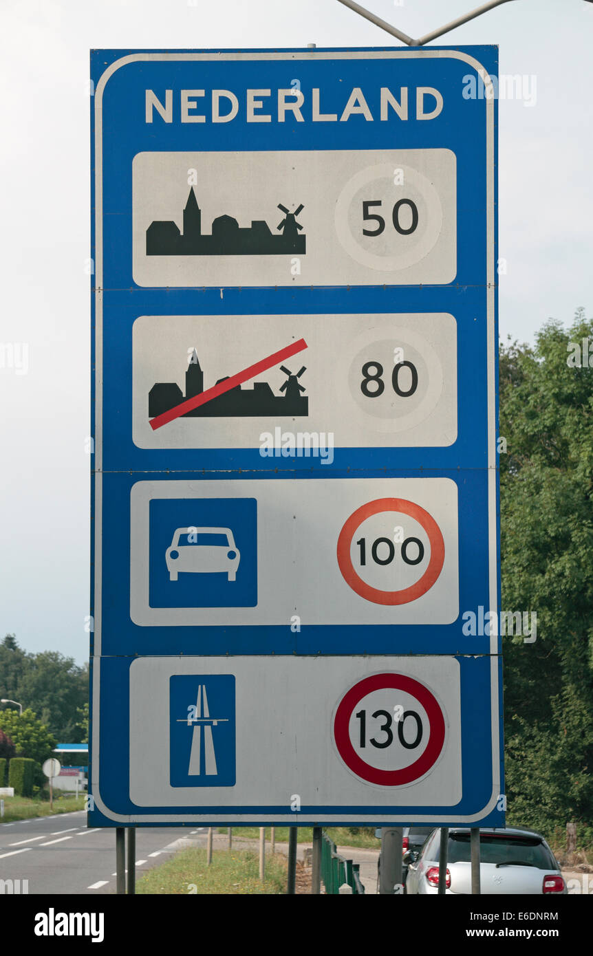 A road speed limit sign on the border between the Netherlands (Nederland) and Belgium (Belgique). Stock Photo