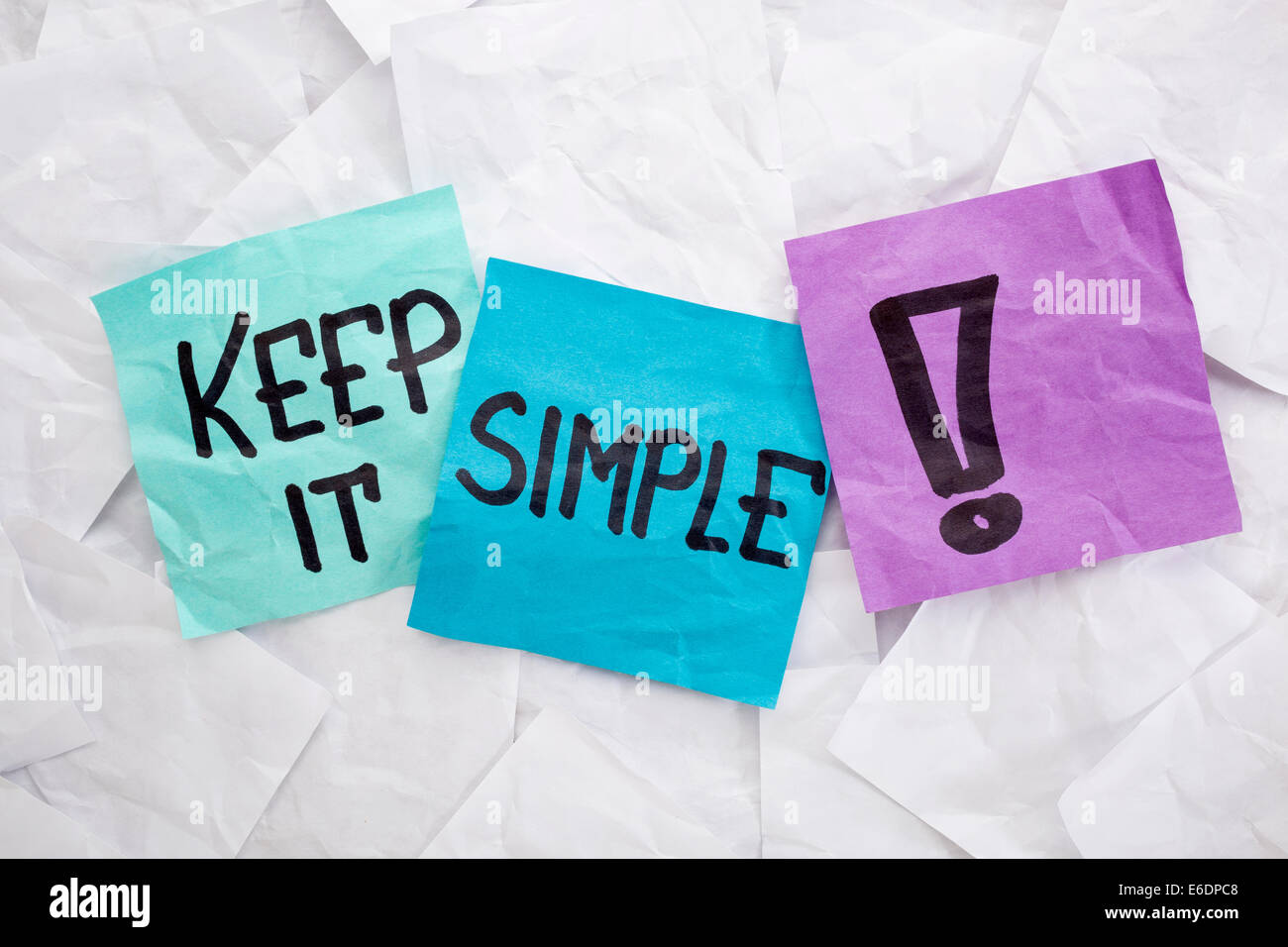 keep it simple - reminder or advice handwritten on colorful sticky notes Stock Photo