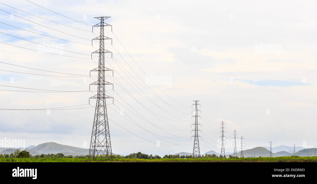 These electricity transmission pylons help distribute the power into the rural area. Stock Photo
