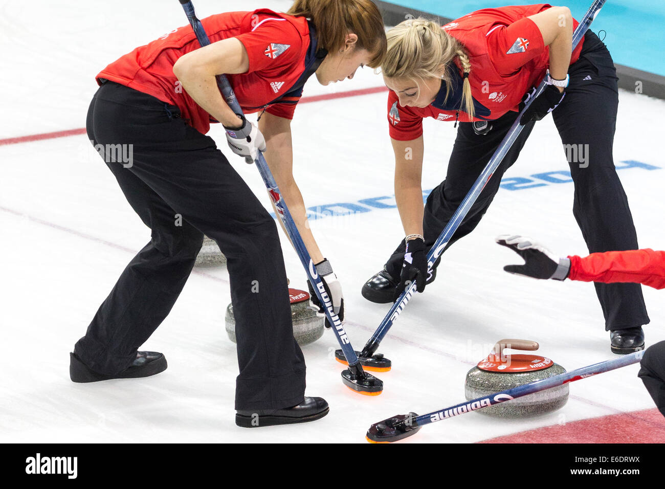 Claire Hamilton and Anna Sloan (R) of Team Great Britain sweep during Women's curling