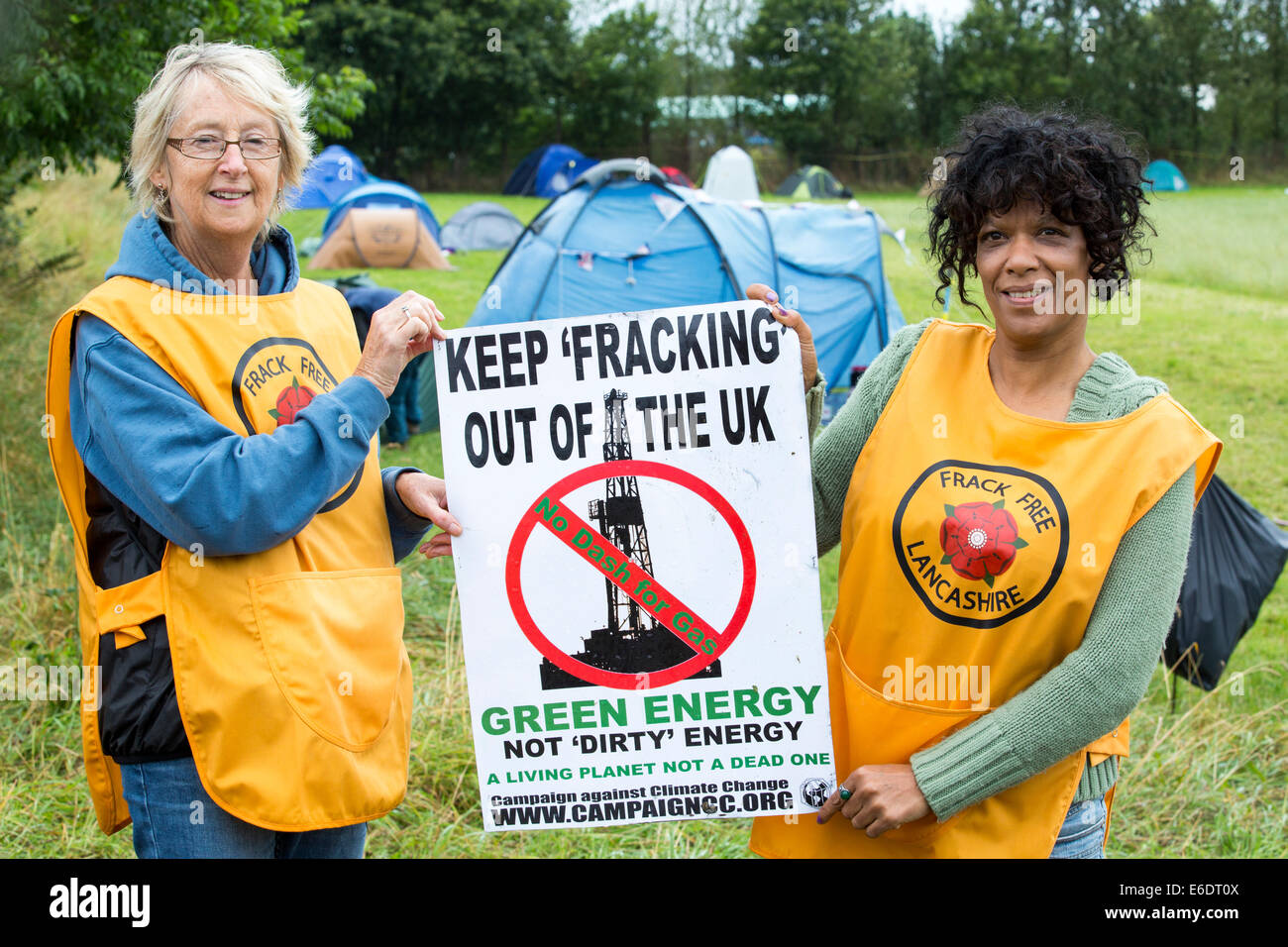 Protestors with a protest banner against fracking at a farm site at Little Plumpton near Blackpool, Lancashire, UK, where the council for the first time in the UK, has granted planning permission for commercial fracking fro shale gas, by Cuadrilla. Stock Photo