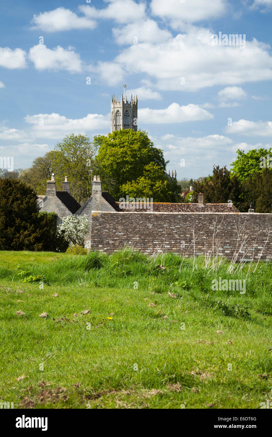 The view across the rooftops of Fotheringhay village towards All Saints church from atop the castle mound, Northamptonshire, England Stock Photo