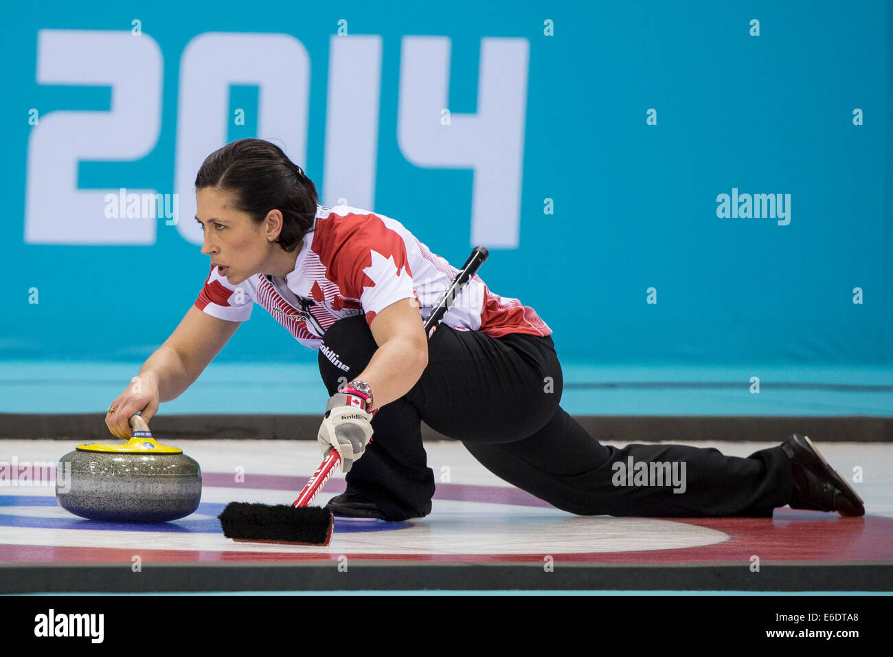 Jill Officer of Gold medal winning Canada places a stone during Women's